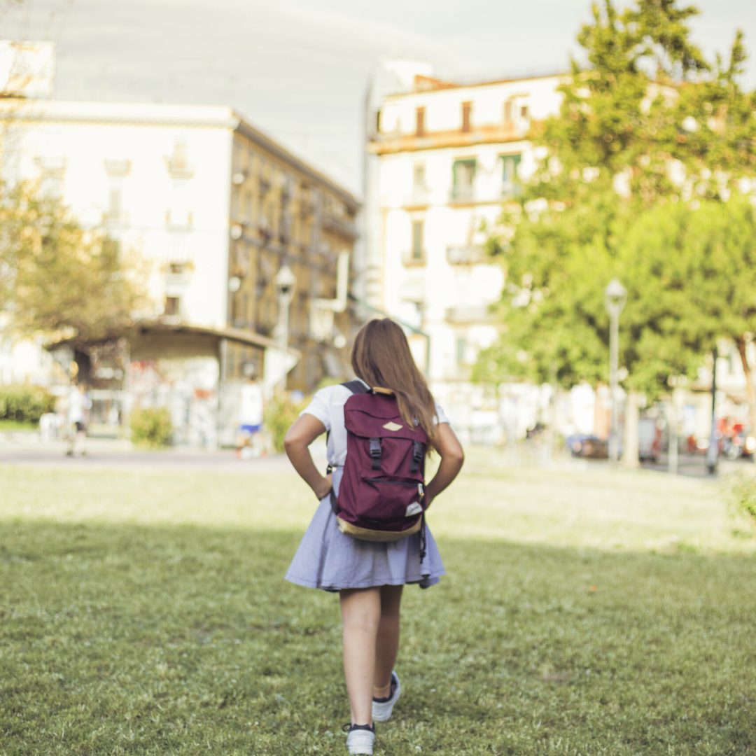schoolgirl-walking-city-park